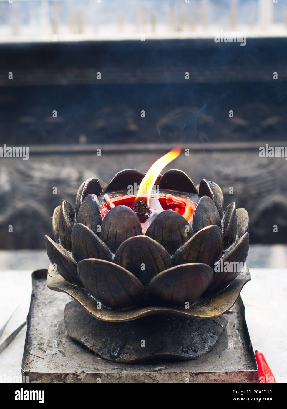 Chinese Candle Flame with Candle Oil Holder in Shaolin Temple. Dengfeng, Zhengzhou City, Henan