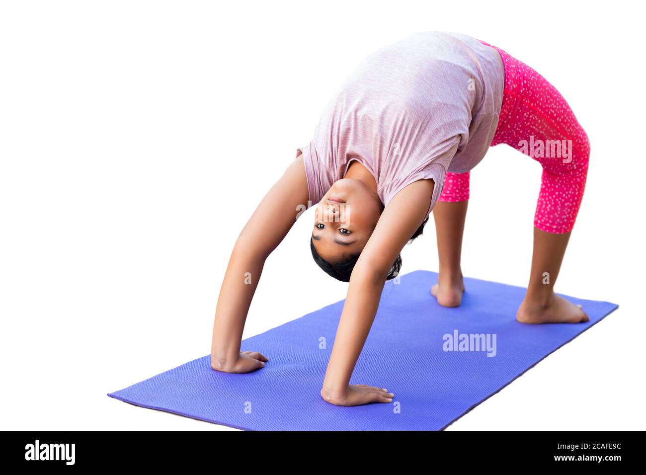 Young Girl Doing Bridge Stretch on Yoga Mat, Isolated, White Stock
