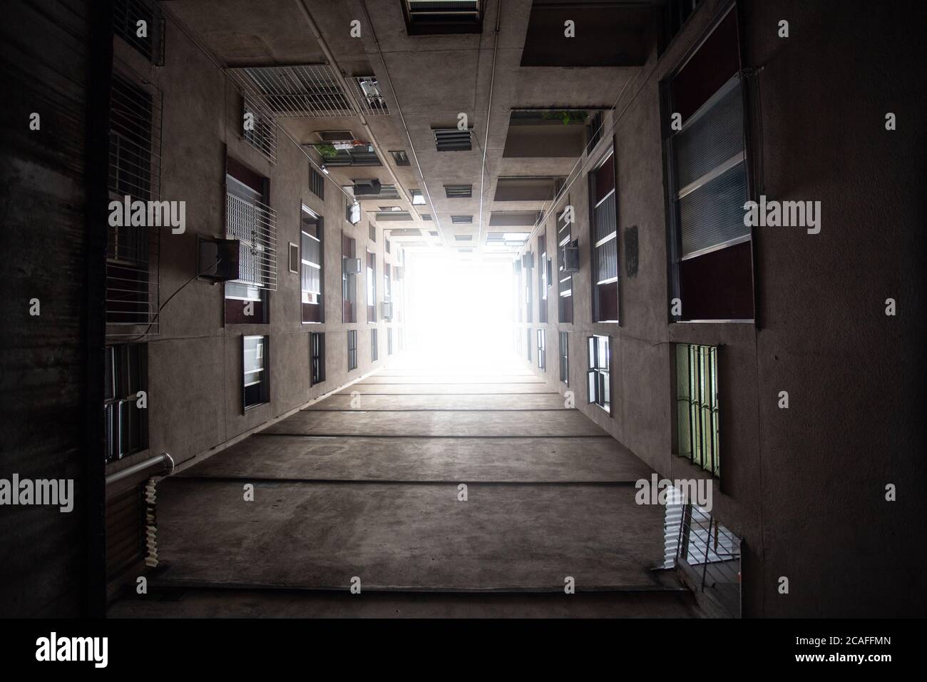Low angle shot of the facade of a residential building under a cloudy ...