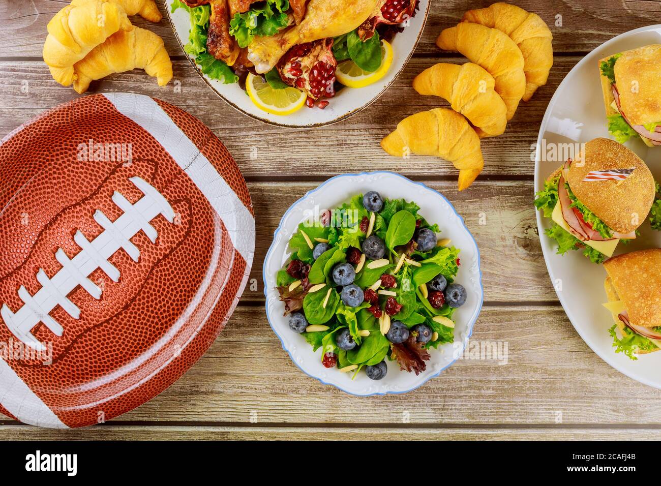 Party table with variety food for sport fans for watching american