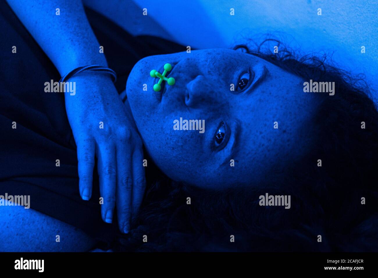 redhead in blue lights Stock Photo