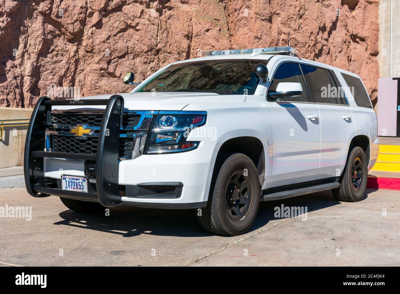 Chevrolet SUV white base model service vehicle wearing U.S. government plates registered to the Department of the Interior - Las Vegas, Nevada, USA - Stock Photo