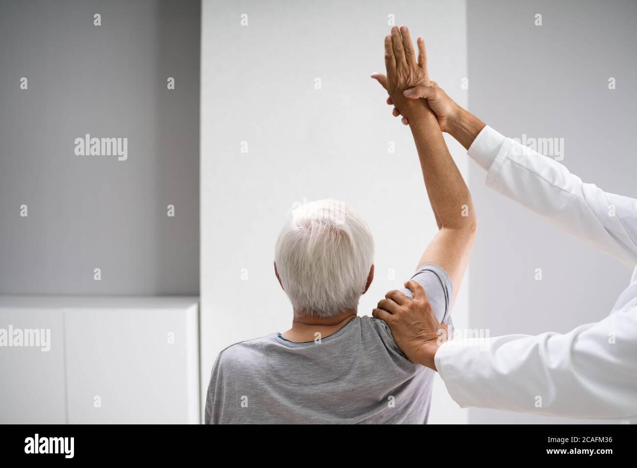 Physical Rehabilitation Therapy Exercise After Shoulder Injury Stock Photo