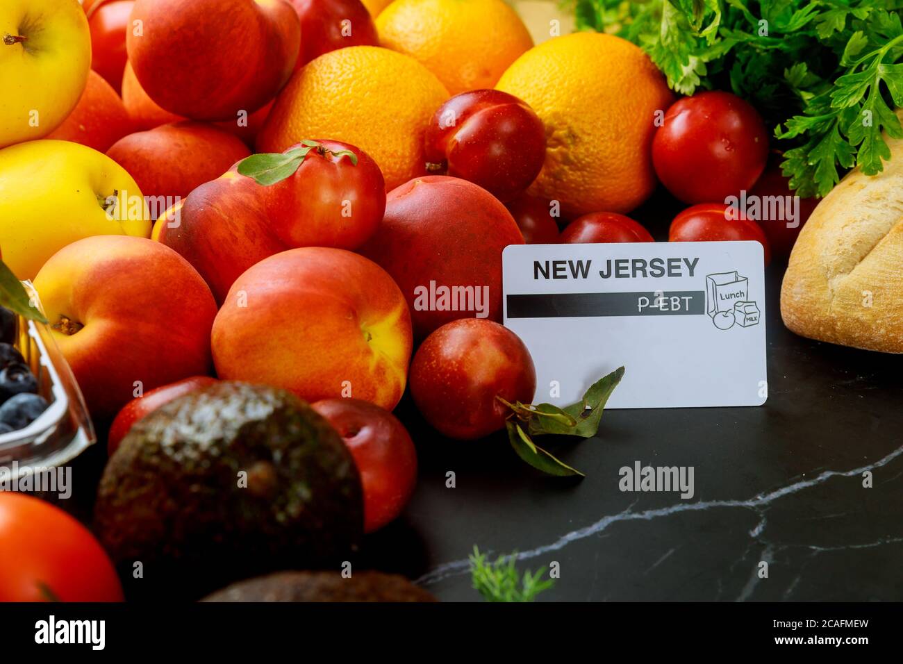 Food stamps card on table with fruits. Food benefits concept Stock