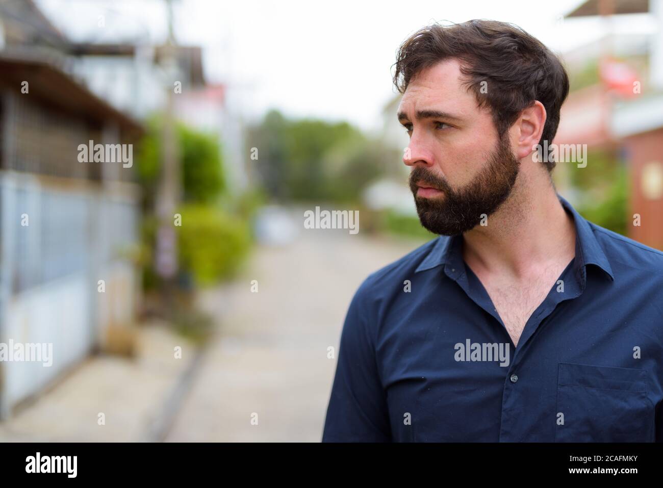 Portrait of handsome businessman with beard outdoors Stock Photo