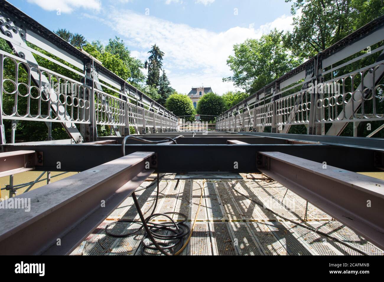 Policka, Czech Republic. 05th Aug, 2020. The listed steel bridge in Policka, Svitavy region, Czech Republic, is seen during repair of that bridge on August 8, 2020. Reconstruction for 6.5 million crowns will last until the end of October 2020. Steel lattice bridge of riveted construction about 20 meters long and 4.3 meters wide on masonry embankment pillars was declared a technical monument in June 2019. Credit: Josev Vostarek/CTK Photo/Alamy Live News Stock Photo