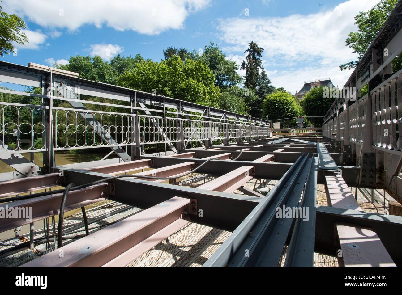 Policka, Czech Republic. 05th Aug, 2020. The listed steel bridge in Policka, Svitavy region, Czech Republic, is seen during repair of that bridge on August 8, 2020. Reconstruction for 6.5 million crowns will last until the end of October 2020. Steel lattice bridge of riveted construction about 20 meters long and 4.3 meters wide on masonry embankment pillars was declared a technical monument in June 2019. Credit: Josev Vostarek/CTK Photo/Alamy Live News Stock Photo