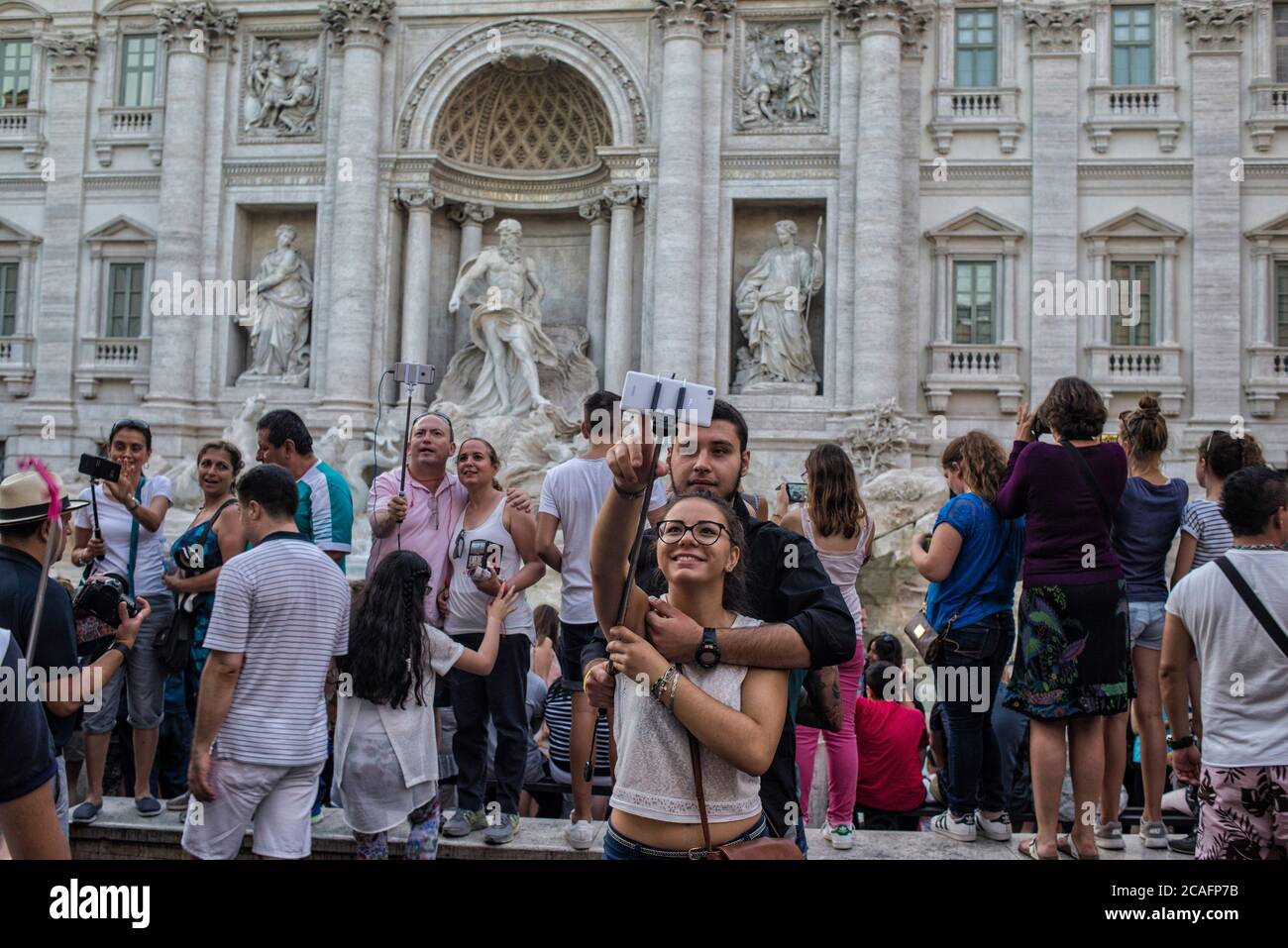 Europe - Italy, capital city Rome: Tourist taking a “selfie” at the Trevi Fountain which is one of the most popular spots in Rome, thousands of people Stock Photo