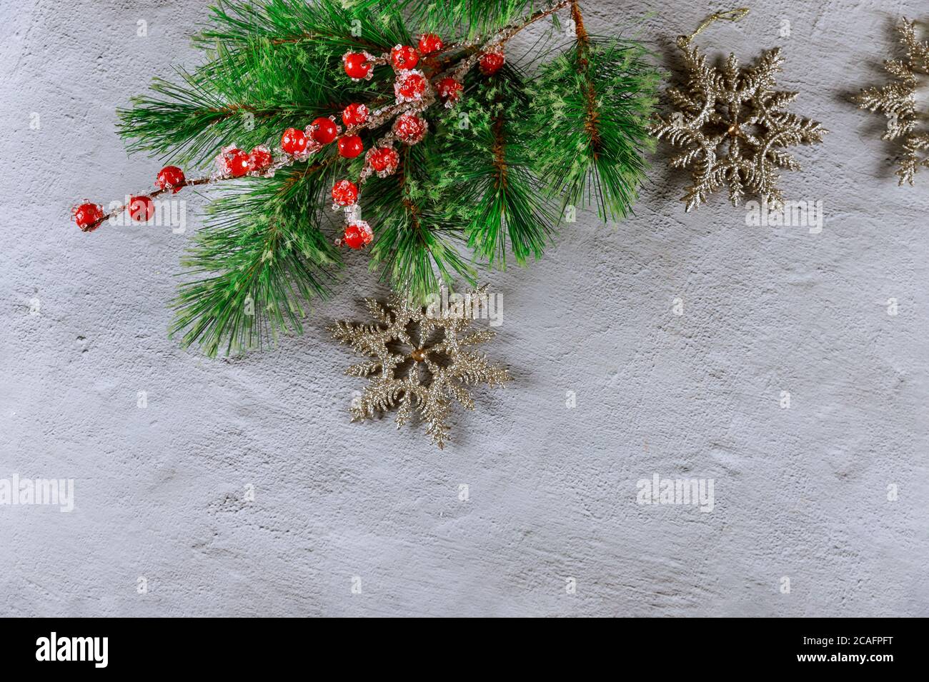 Christmas background with fir branche, red berries and snowflakes on ...
