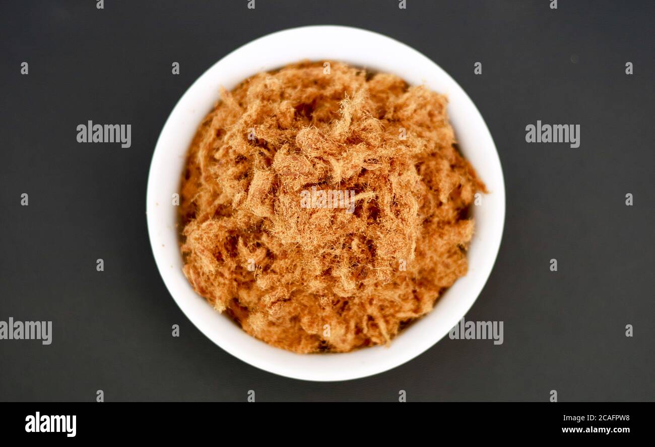 Rousong or beef floss on black background Stock Photo - Alamy