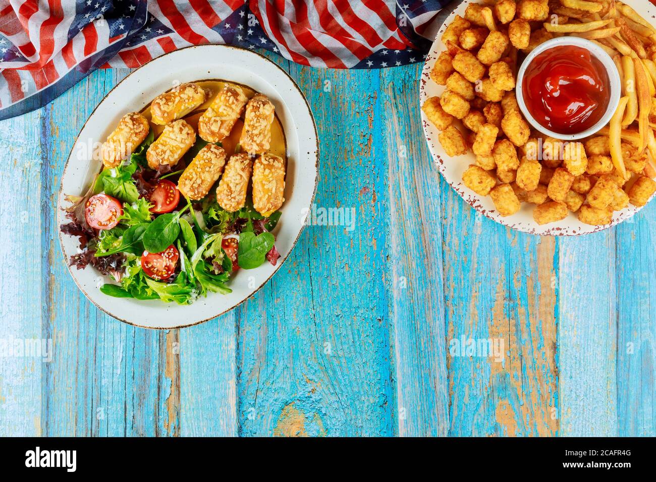 Festive american party table with fried potato, pretzels and vegetable