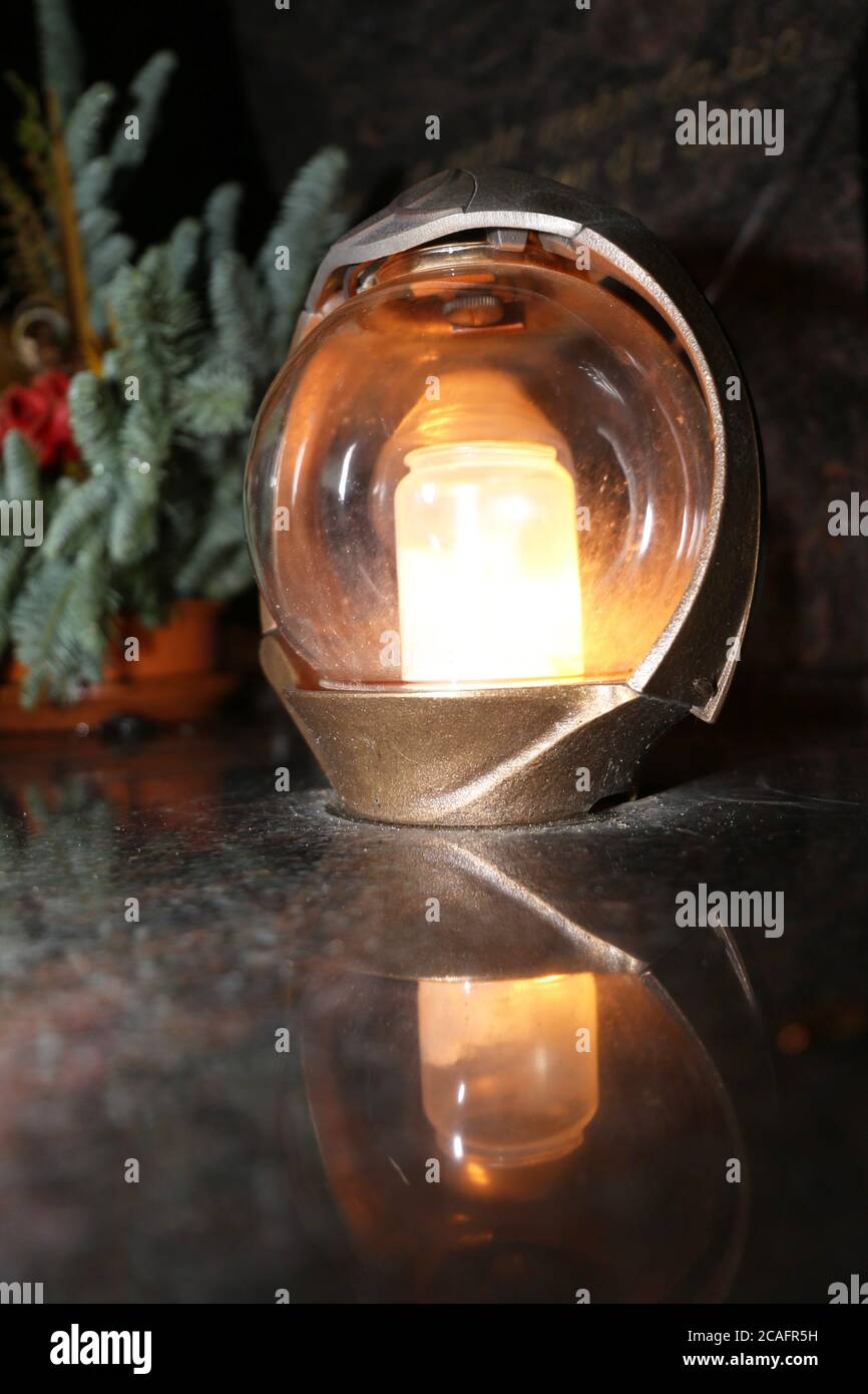 Lighting candles for the dead on All Saints Day Stock Photo Alamy