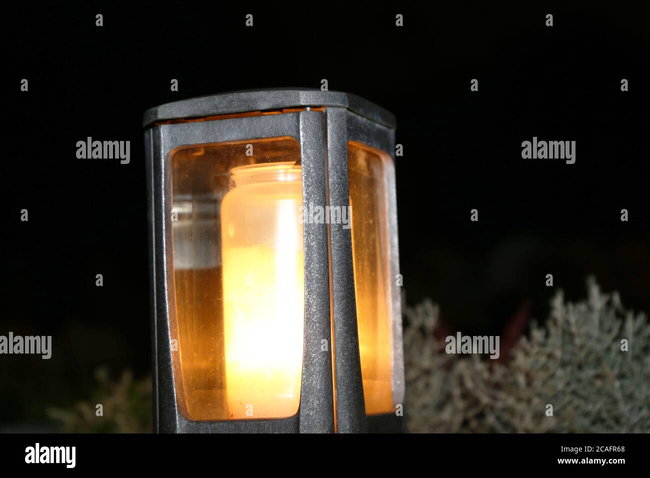 Lighting candles for the dead on All Saints Day Stock Photo Alamy