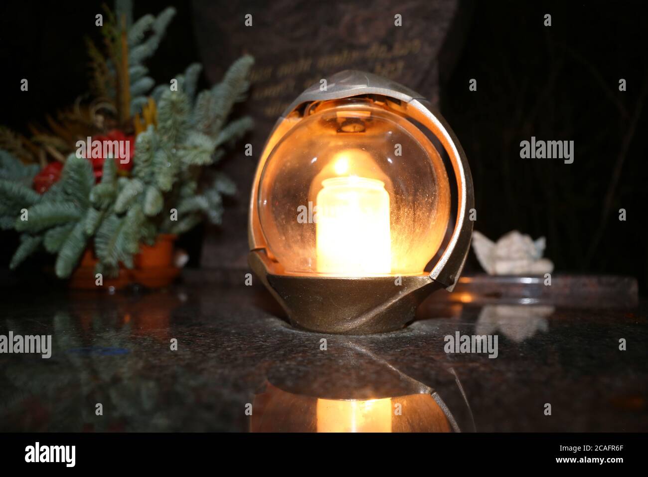 Lighting candles for the dead on All Saints Day Stock Photo Alamy