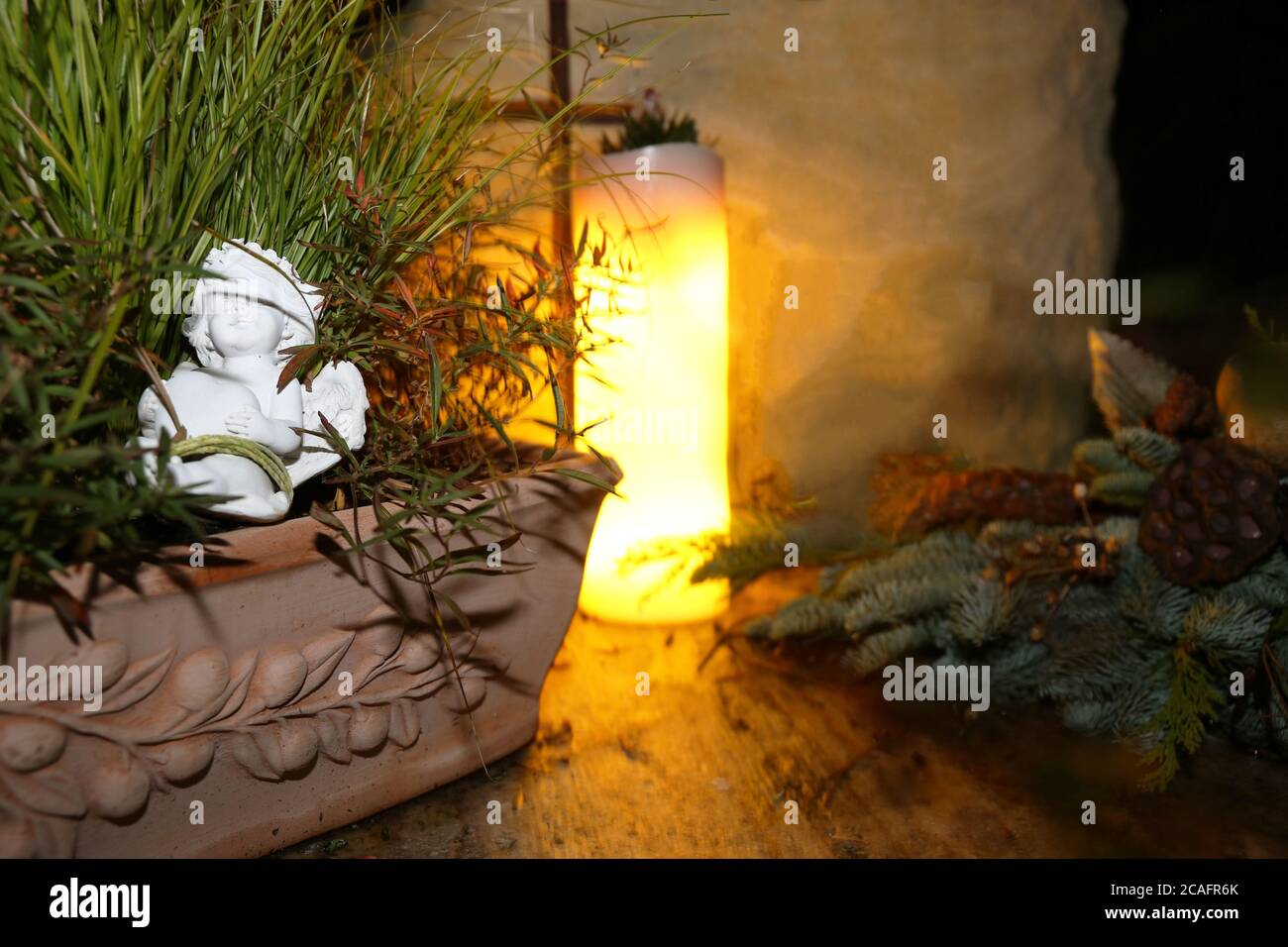 Lighting candles for the dead on All Saints Day Stock Photo Alamy