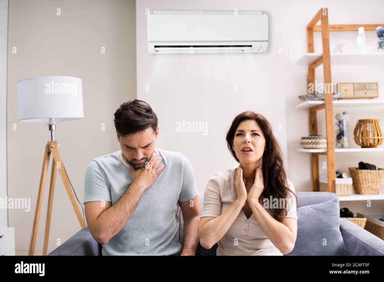 Sick Couple Having Cold And Sore Throat From Air Conditioner Stock Photo Alamy