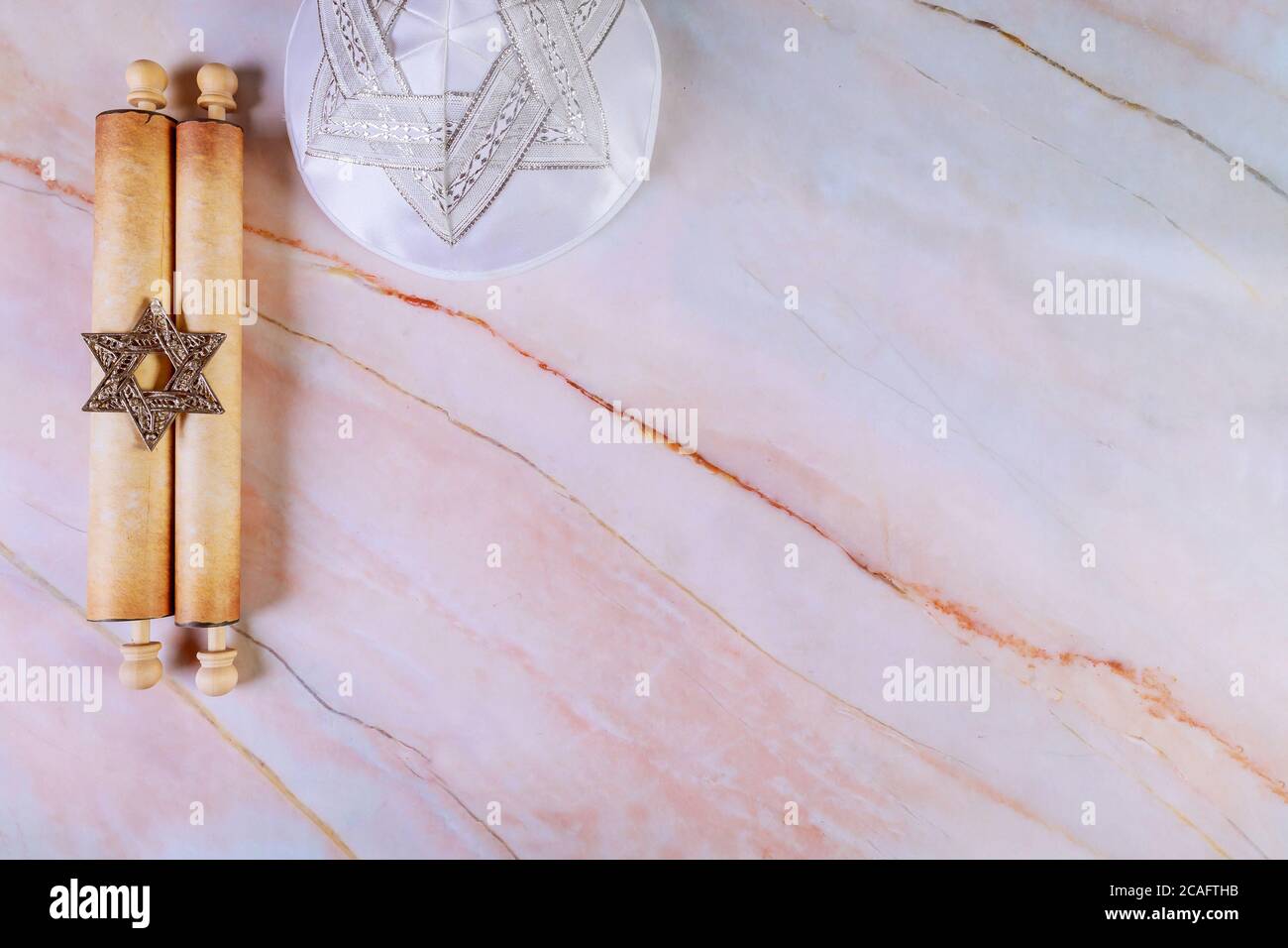 Jewish manuscript, old papyrus roll on abstract background. Stock Photo
