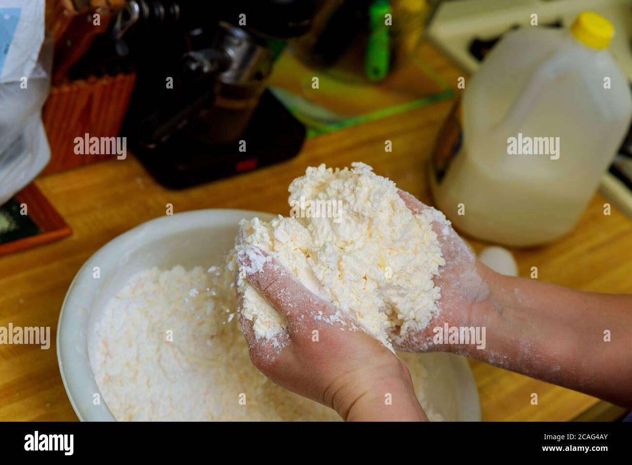 Making dough for baking cheese bread called chipa. Cuisine of Paraguay. Stock Photo
