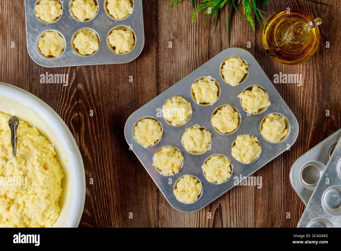 Making cheese bread called chipa. Raw dough in baking pan. Cuisine of Brazil. Stock Photo