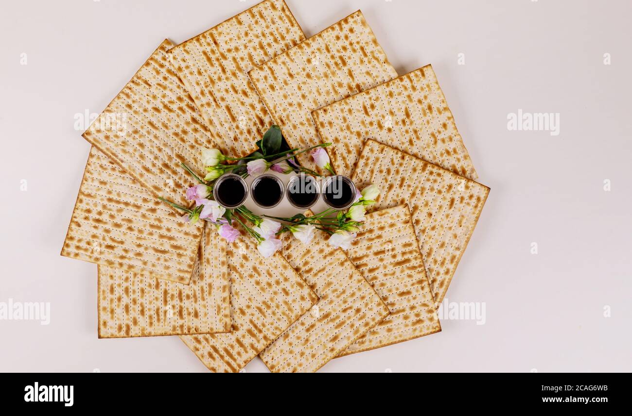 Matzah and four wine cups. Jewish holidays Passover concept Stock Photo ...