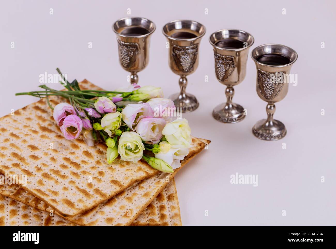 Matzah and four wine cups. Jewish holidays Passover concept Stock Photo ...