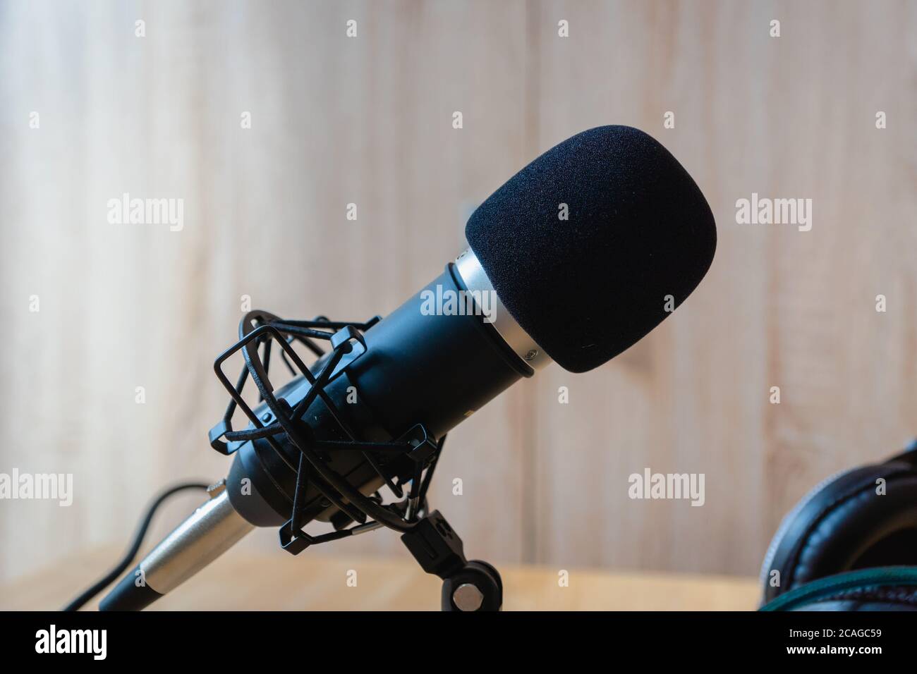 Microphone -  professional condenser microphone in a home studio for podcast, music production, voice over, recording Stock Photo