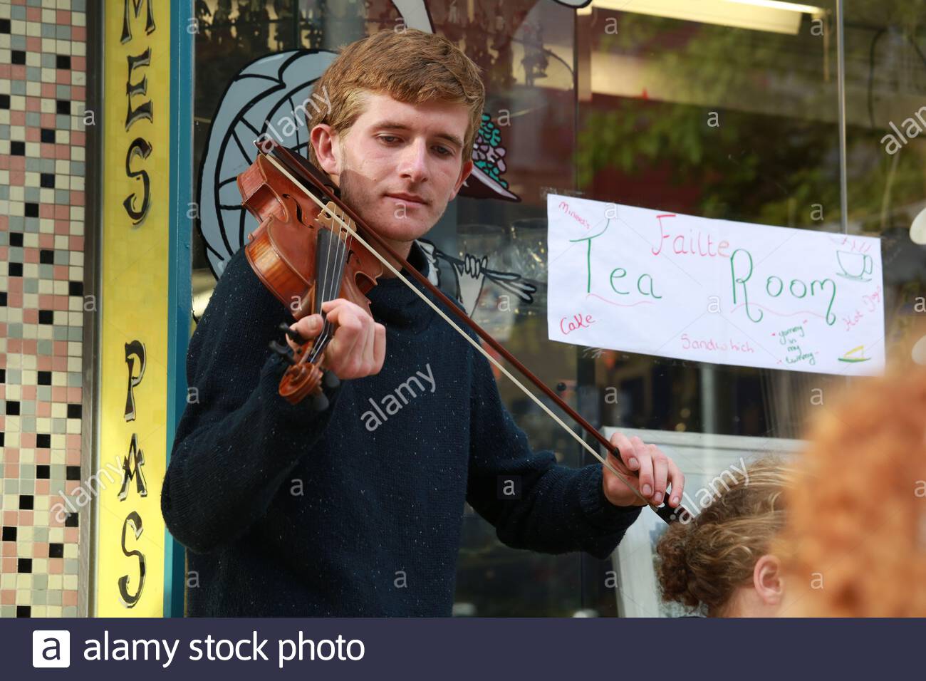 A young man performing Irish traditional music in Drogheda during the Fleadh Cheoil music festival Stock Photo