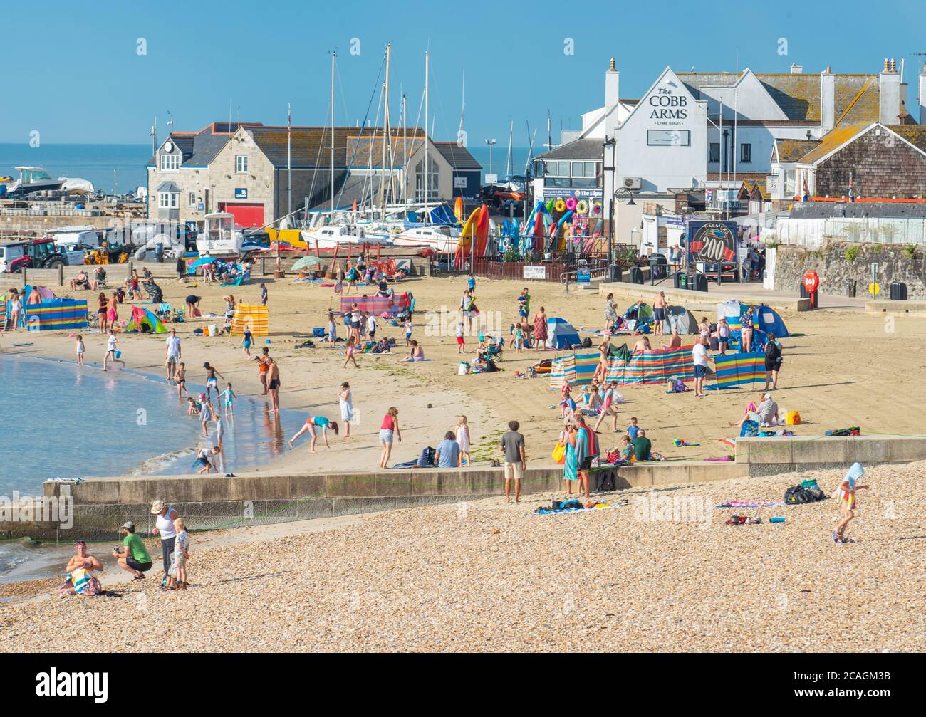 Lyme Regis, Dorset, UK. 7th Aug, 2020. UK Weather Beachgoers