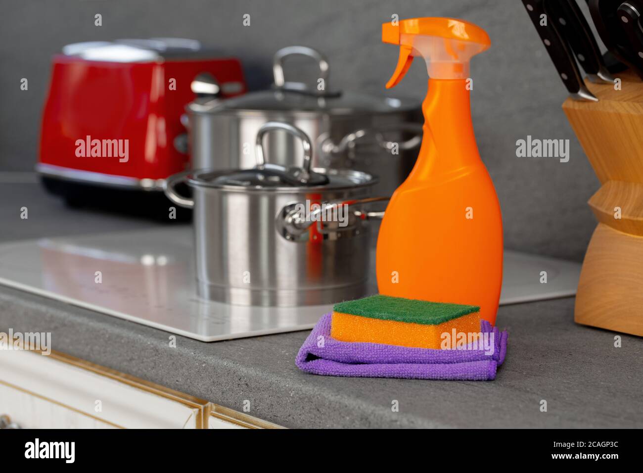 Cleaning detergents and tools on a kitchen counter Stock Photo Alamy