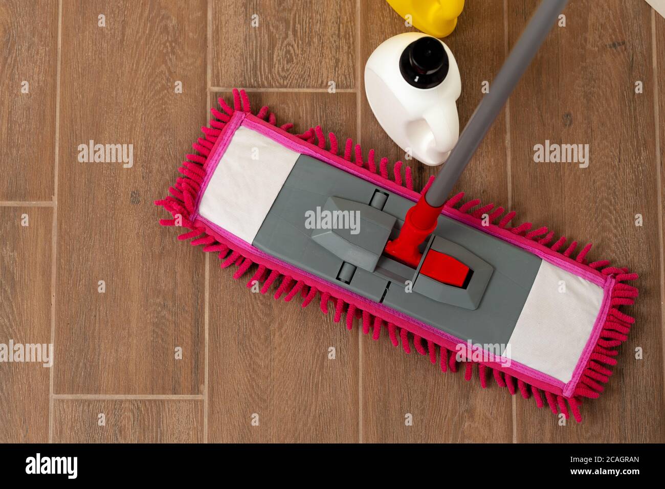 Premium Photo  Close up picture of wooden floor with pink cleaning mop