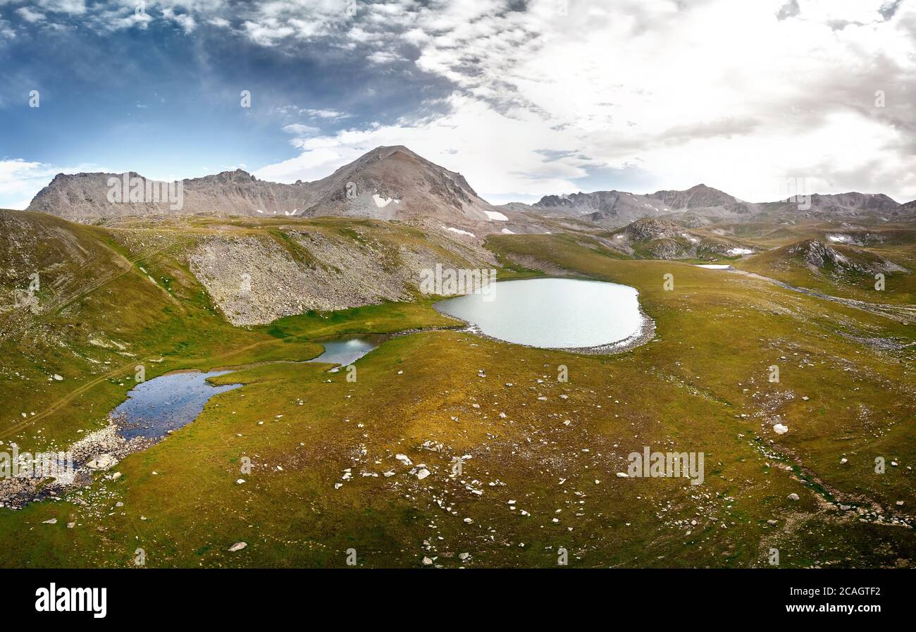Beautiful scenery of the mountain lakes on the border Kazakhstan and Kyrgyzstan. Aerial shot on the drone Stock Photo
