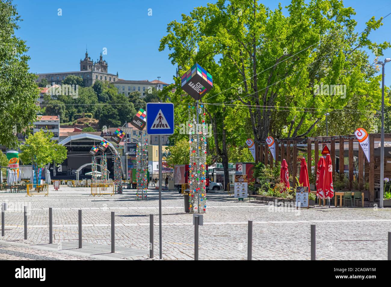 Viseu / Portugal - 07/31/2020 : View at the Viseu city downtown, with the magic cube event, and Cathedral of Viseu and Church of Mercy on top Stock Photo