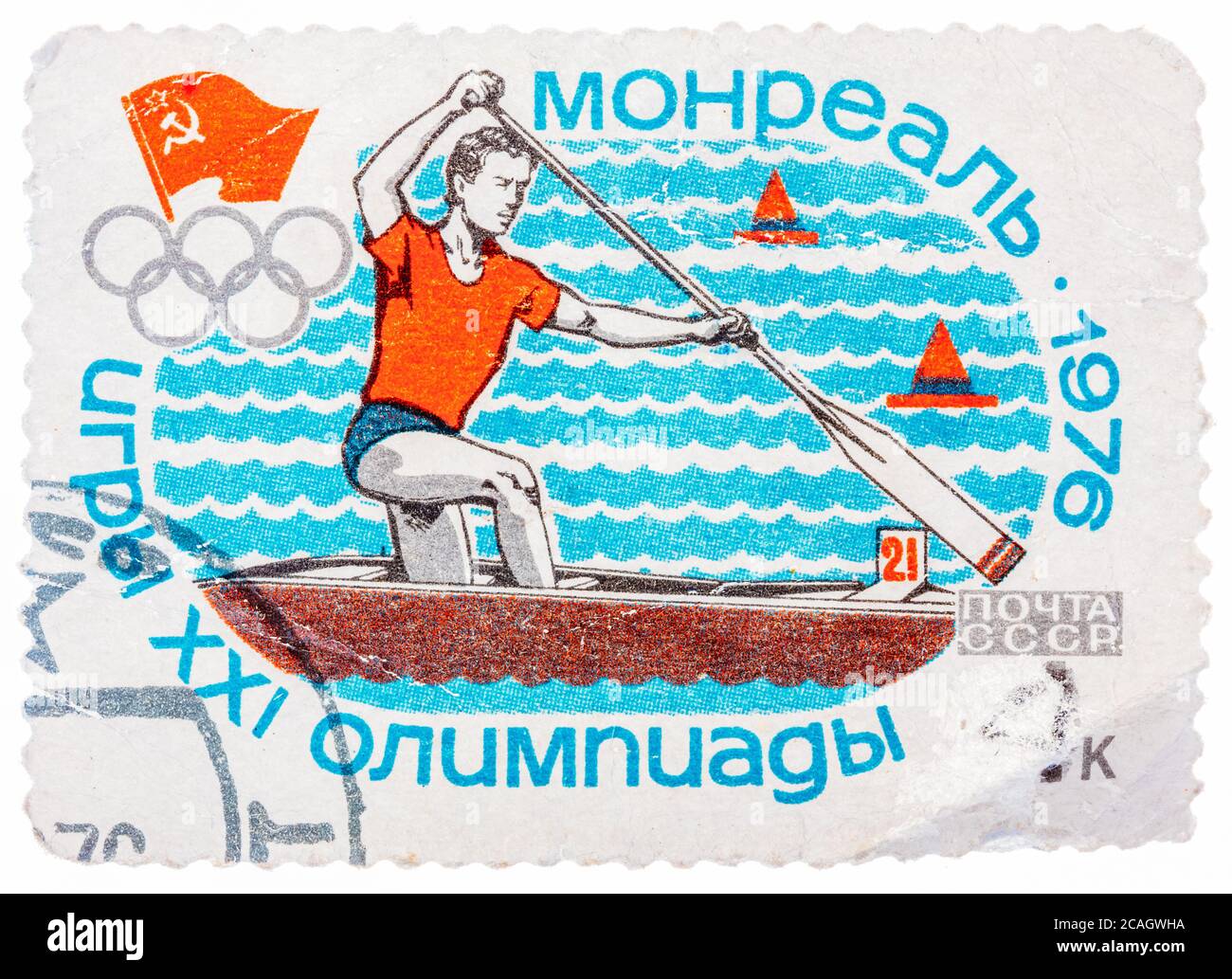 Stamp printed in Russia (Soviet Union), Summer Olympics in Montreal, canoeing, athlete is swimming in a boat with a paddle Stock Photo