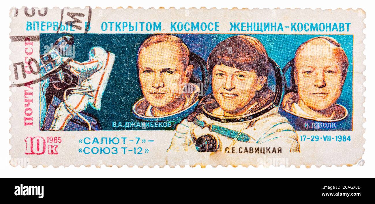 Post stamp printed in USSR (Russia), shows astronauts Janibekov, Savitskaya and Volk with inscriptions and name of series 'Soyuz T-12, Salyut 7, Space Stock Photo