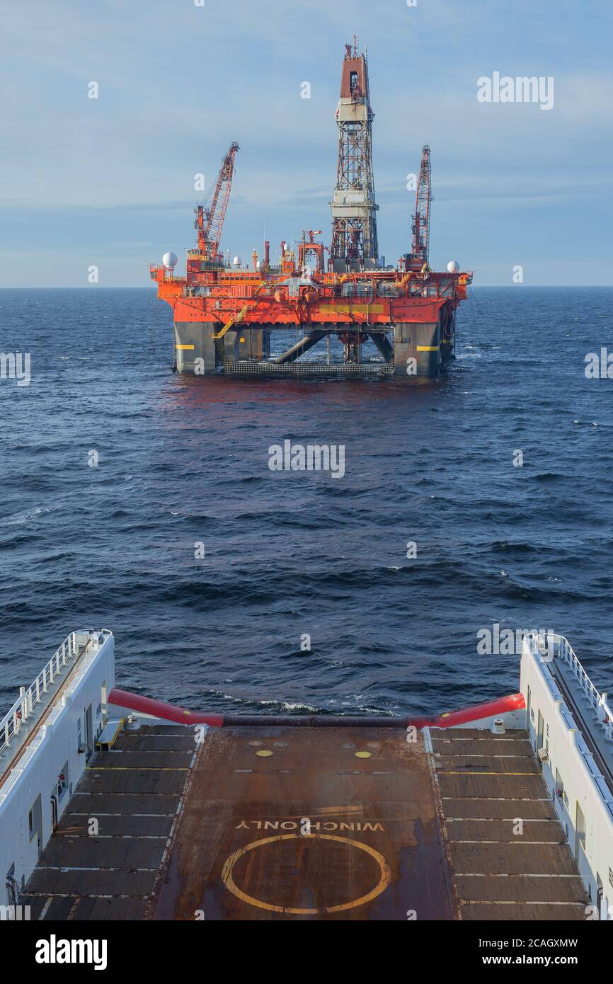 A semi-submersible drilling rig seen from the view from the bridge off an offshore vessel. Stock Photo