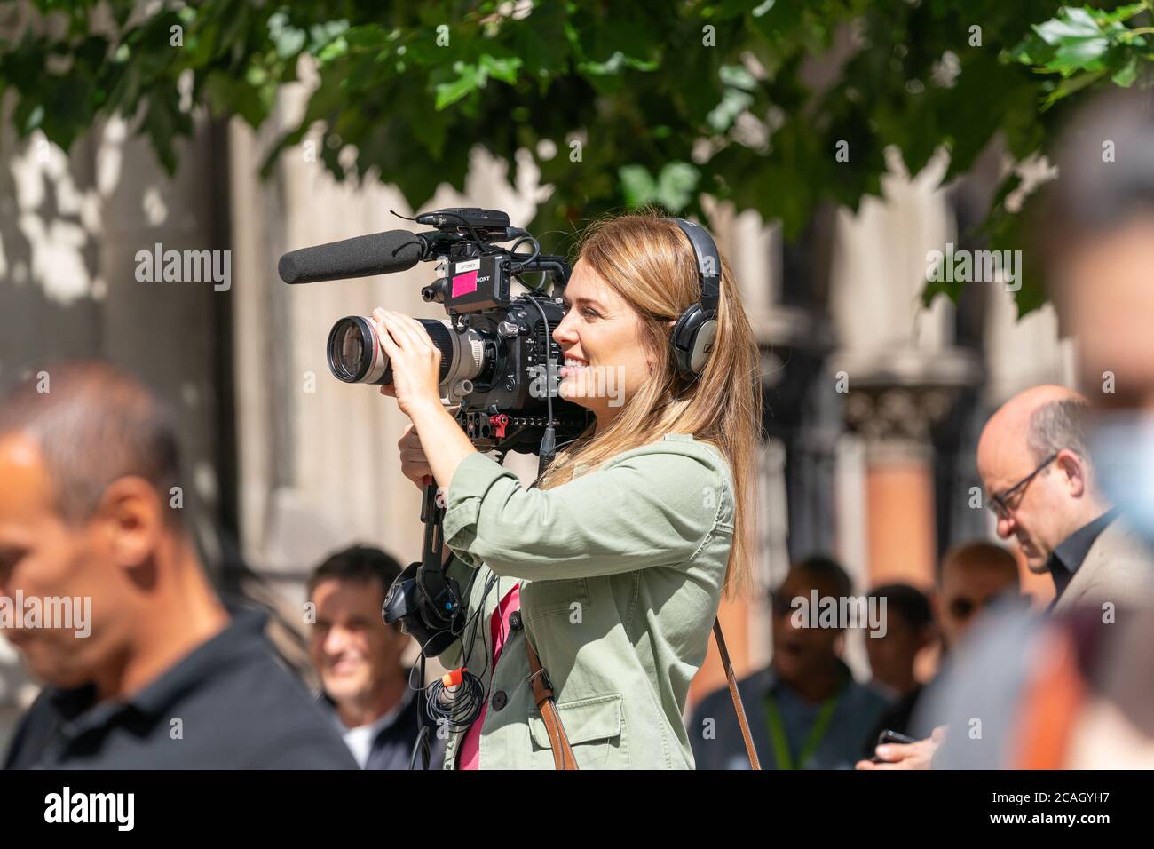 LONDON, ENGLAND JULY 28, 2020 Beautiful female camerawoman wearing