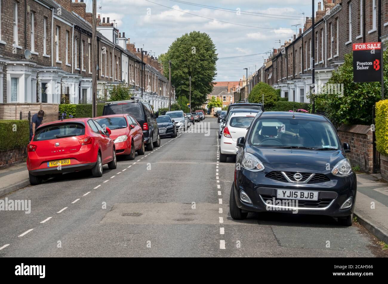 On street residents car cars parking and terrace houses housing near the city centre York North Yorkshire England UK United Kingdom GB Great Britain Stock Photo