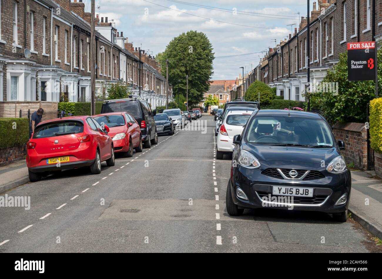 On street residents car cars parking and terraced houses housing near