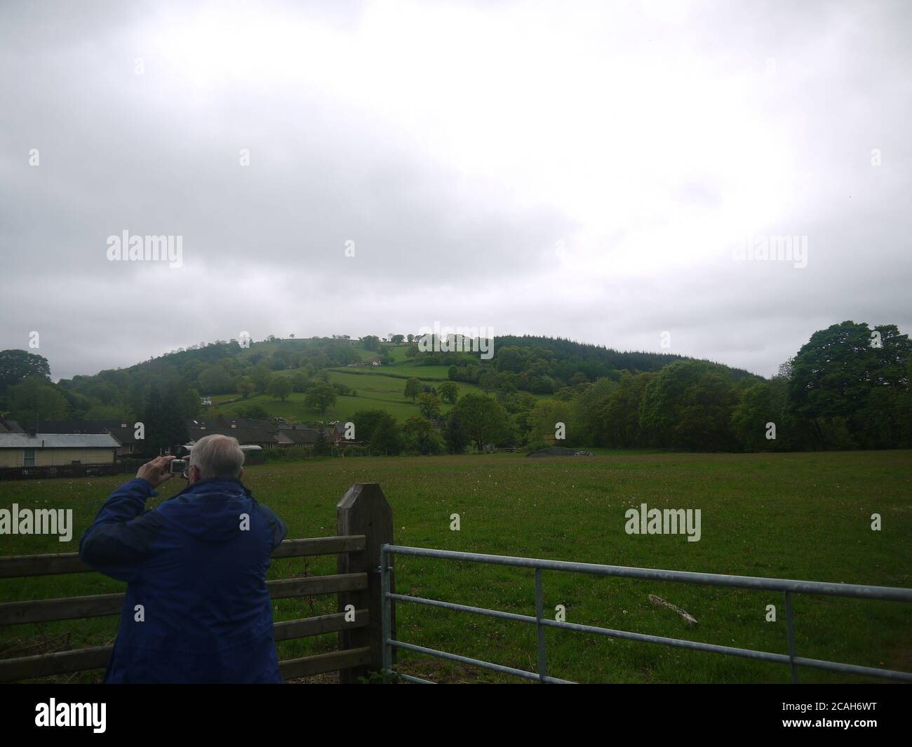 Old Man Taking a Photo of a Steam Train Stock Photo