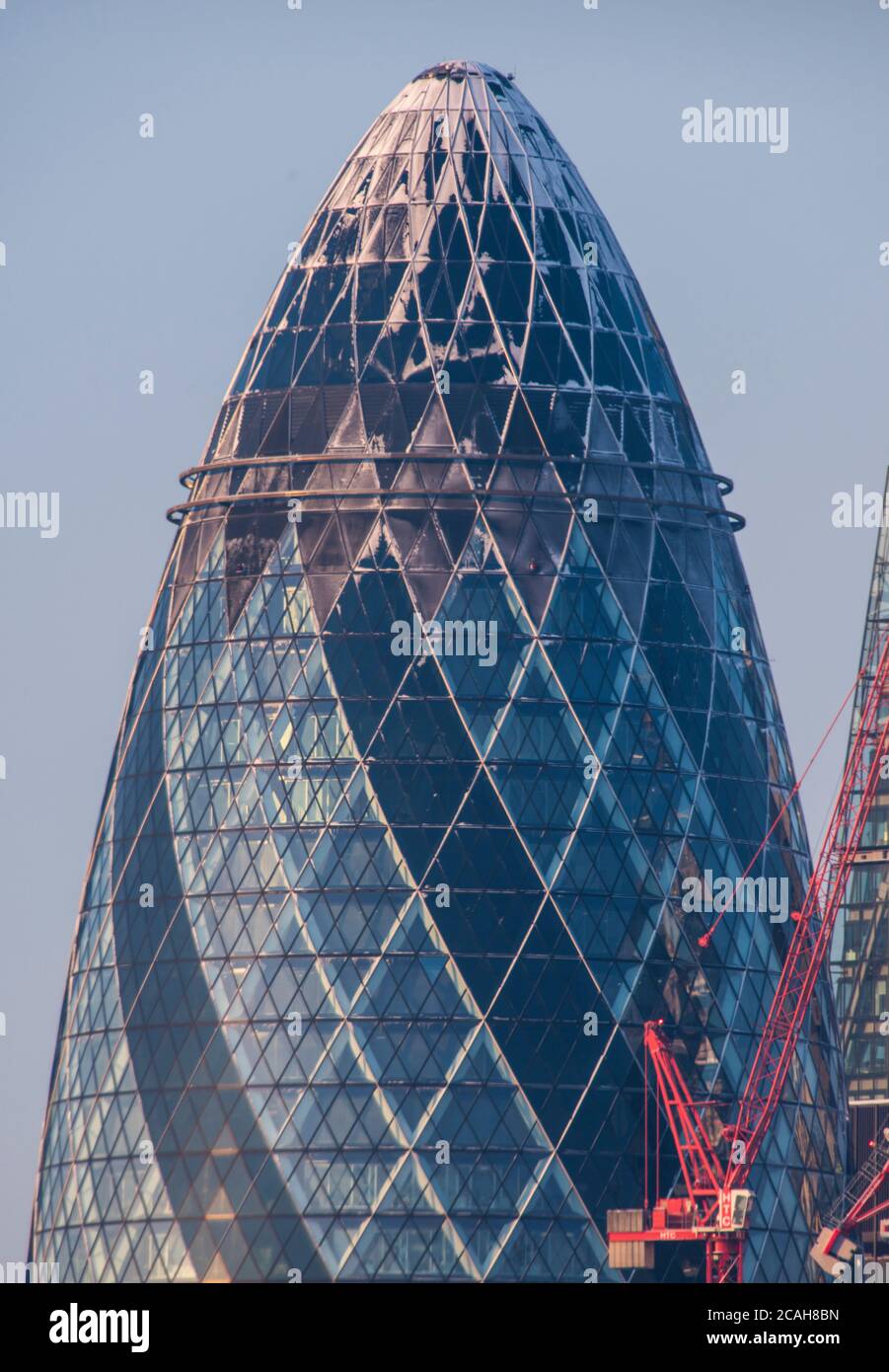 Top of the Gherkin capped with snow. 30 St Mary Axe, London, United Kingdom. Architect: Foster + Partners, 2004. Stock Photo