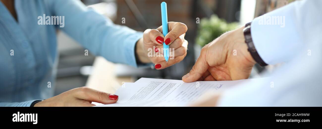 Business woman signs contract in office closeup Stock Photo