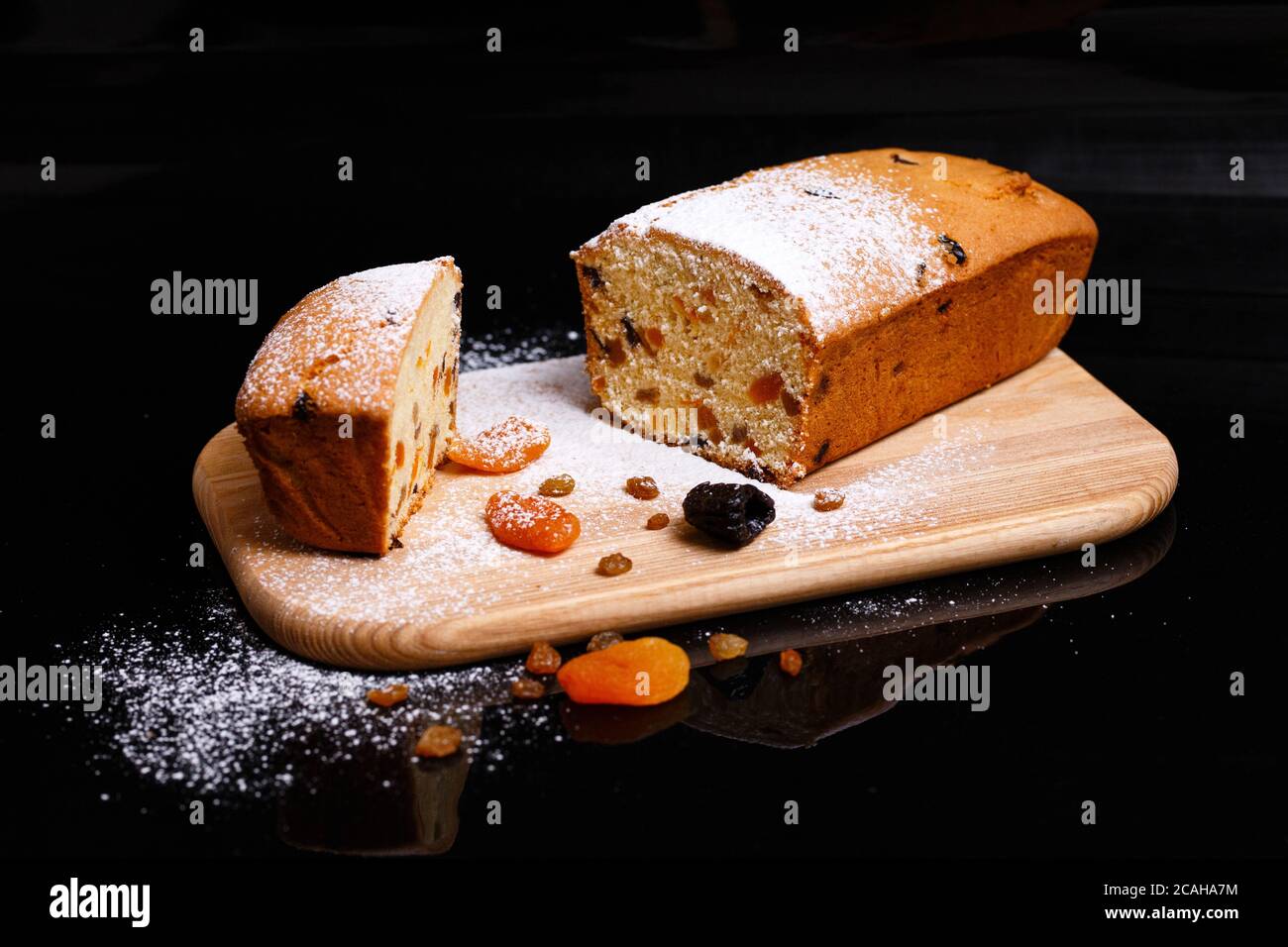 Sweet cupcake in the shape of bread. Cupcake with raisins, dried