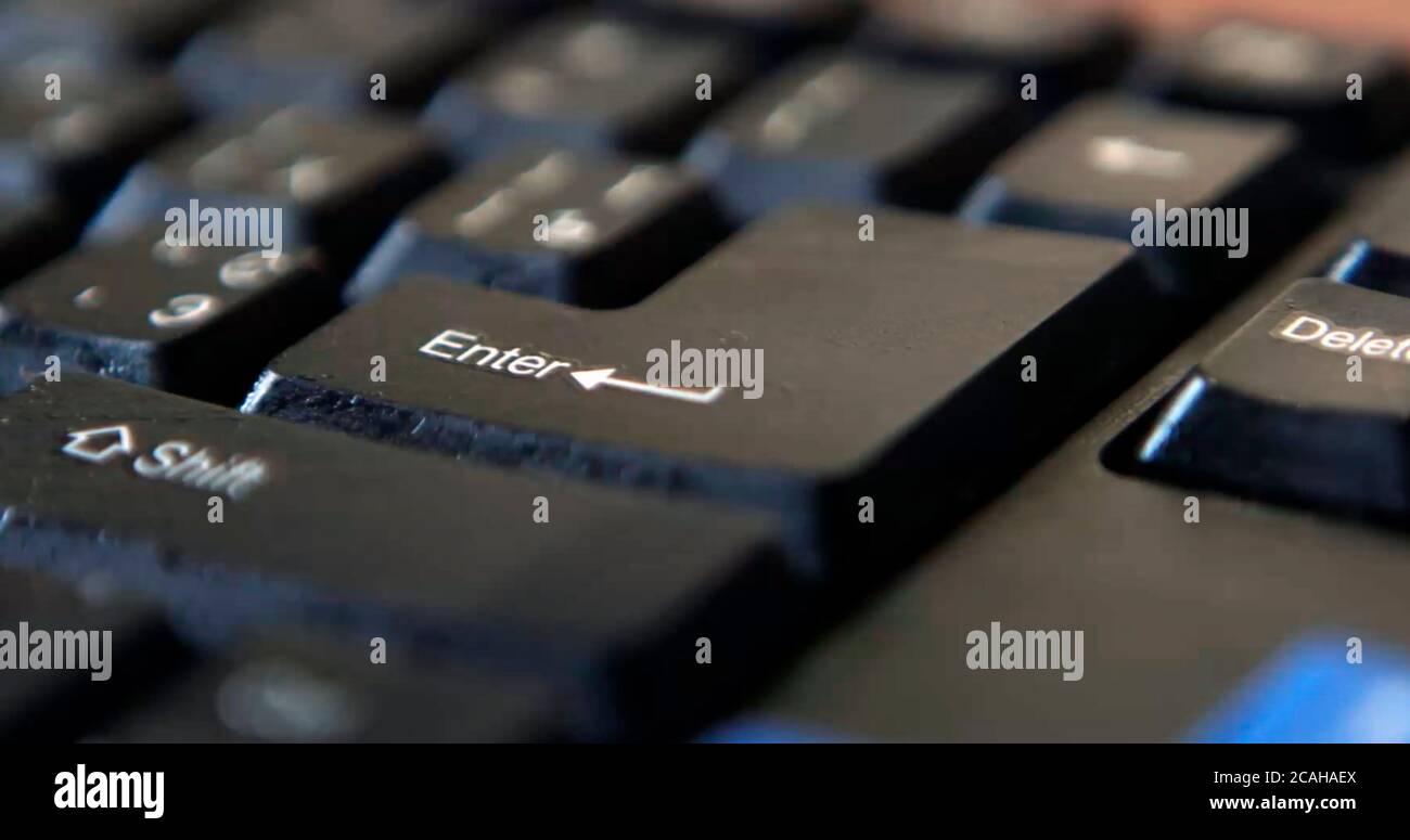 Black computer keyboard super close up stock footage. Black computer enter keys Stock Photo
