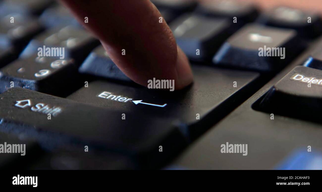 Black computer keyboard super close up stock footage. Black computer enter keys Stock Photo