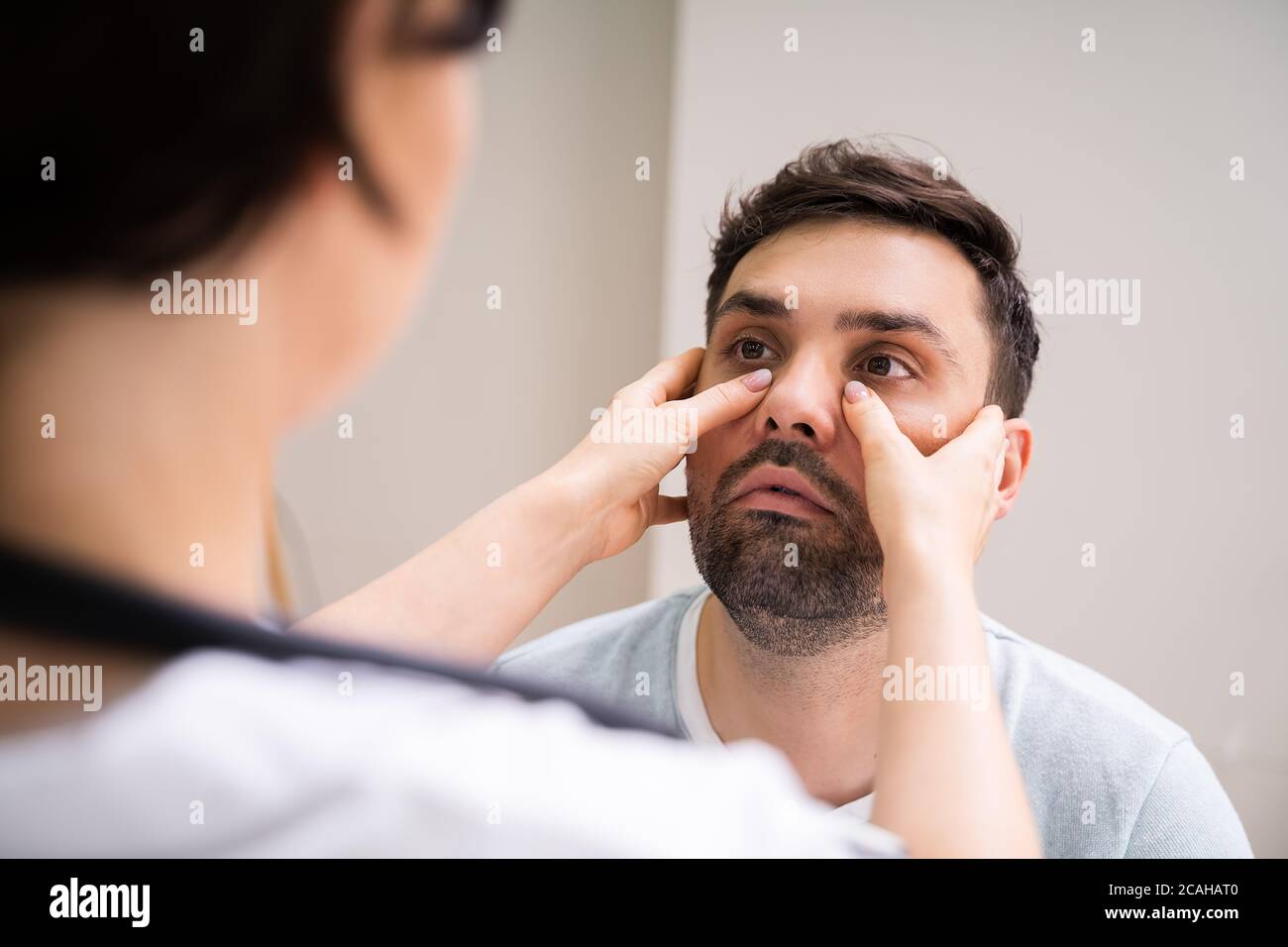 Physician Doctor Doing Sinusitis Examination For Sinus Inflammation