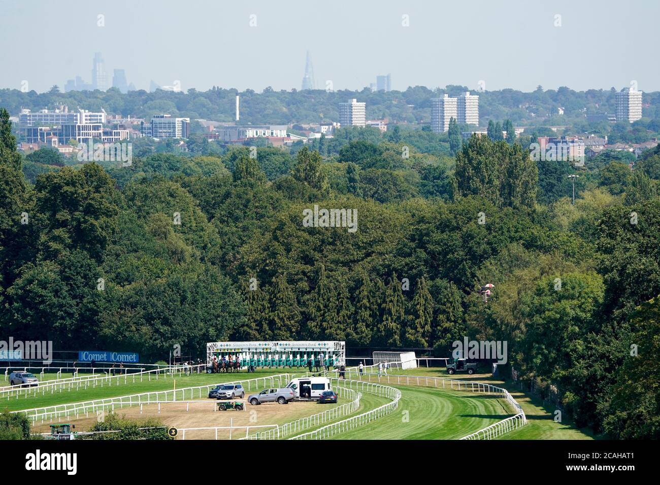 A general view as runners leave the stalls from the five furlong start in The Oxshott Nursery at Sandown Racecourse, Surrey. Stock Photo