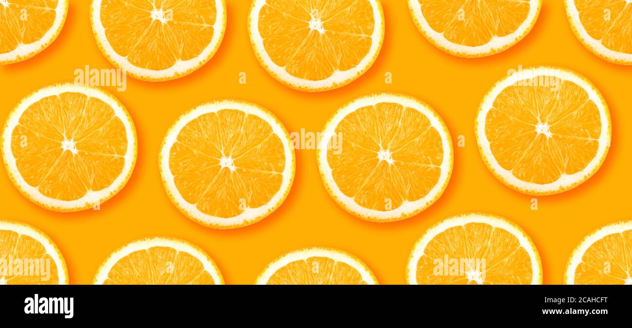 Orange citrus slices seamless backdrop texture. Flat lay backdrop Stock Photo