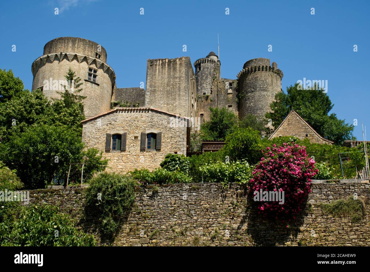 The Chateau de Bonaguil sitting above the village of Bonaguil, near Fumel, Lot-et-Garonne, France Stock Photo