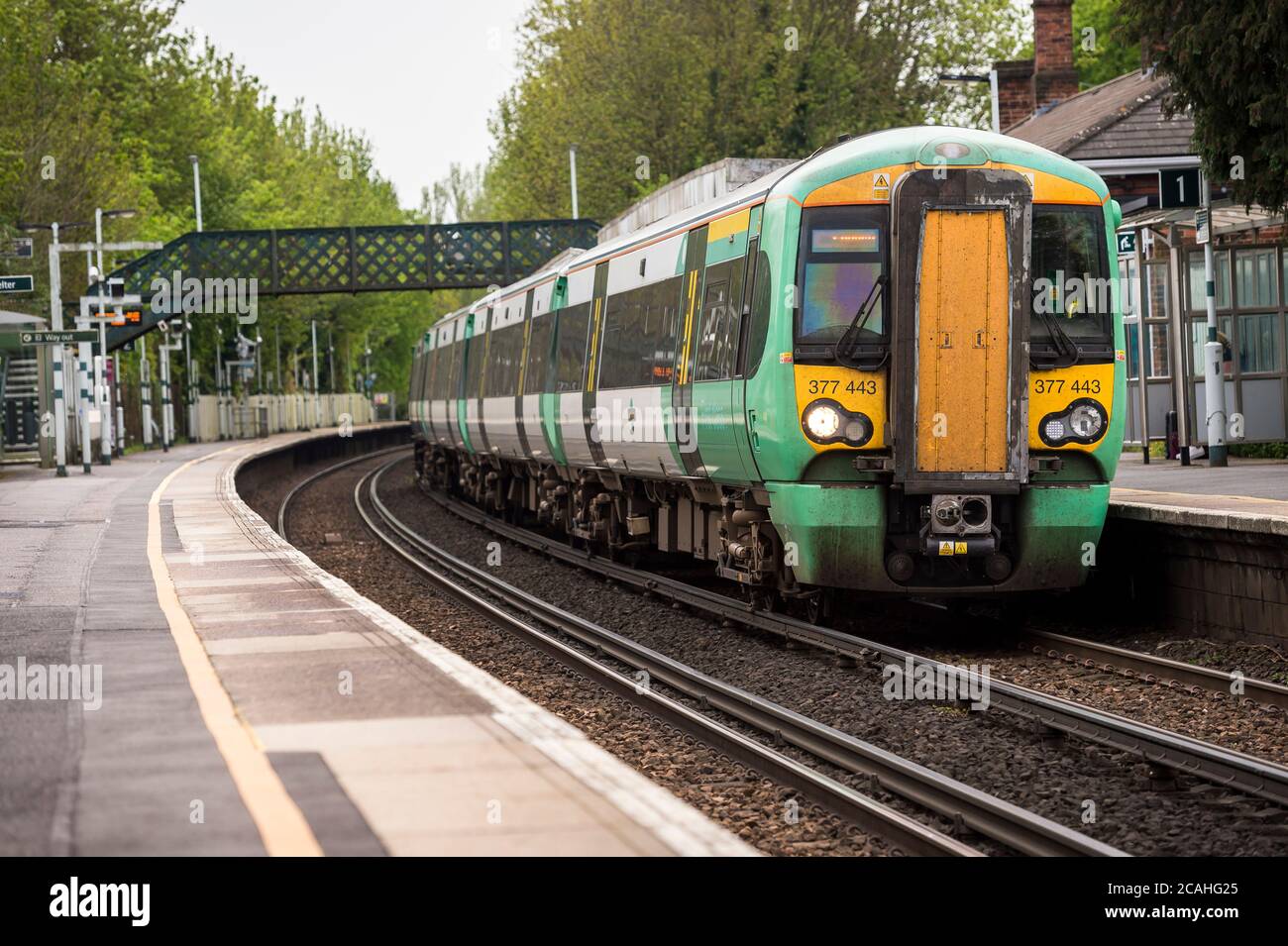 Class 377 passenger train in Southern Trains livery at a railway station, England. Stock Photo