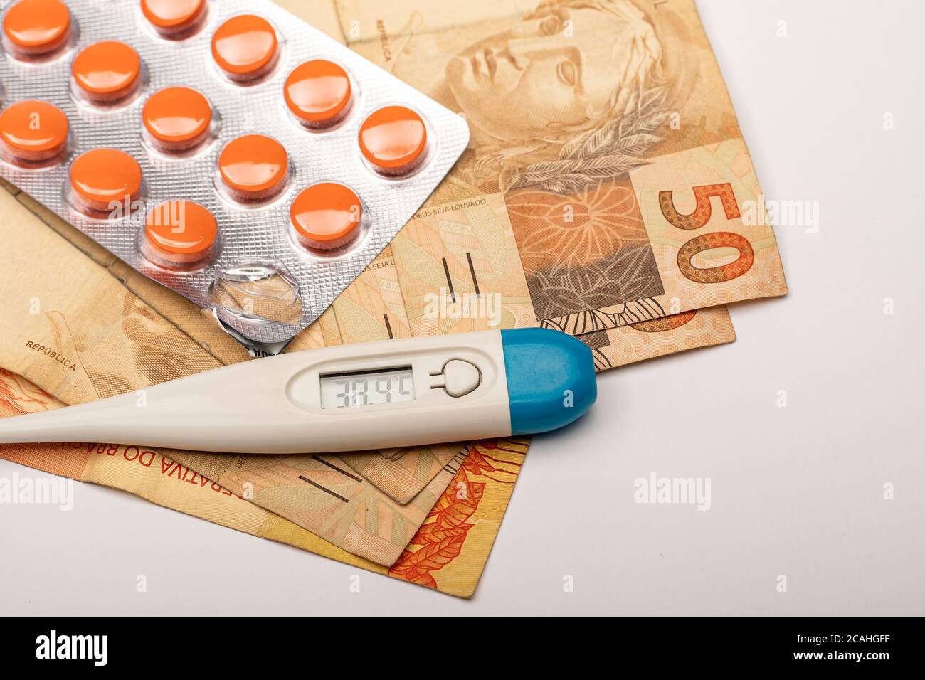 medicine tablet, thermometer indicating 38.9 degrees and Brazilian ...